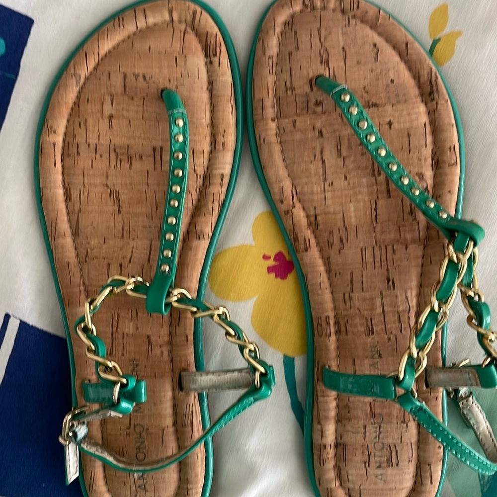 Cushioned soles, cork look bottoms, sandals.